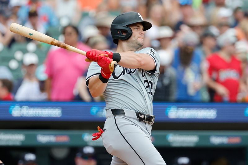 Jun 22, 2024; Detroit, Michigan, USA;  Chicago White Sox left fielder Andrew Benintendi (23) hits a single in the fifth inning against the Detroit Tigers at Comerica Park. Mandatory Credit: Rick Osentoski-USA TODAY Sports