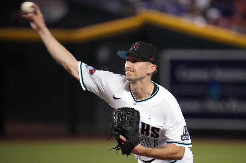 Jun 18, 2023; Phoenix, Arizona, USA; Arizona Diamondbacks starting pitcher Zach Davies (27) pitches against the Cleveland Guardians during the first inning at Chase Field. Mandatory Credit: Joe Camporeale-USA TODAY Sports