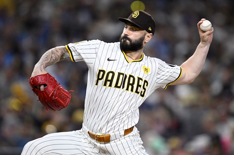 Aug 13, 2024; San Diego, California, USA; San Diego Padres relief pitcher Tanner Scott (66) pitches against the Pittsburgh Pirates during the eighth inning at Petco Park. Mandatory Credit: Orlando Ramirez-USA TODAY Sports