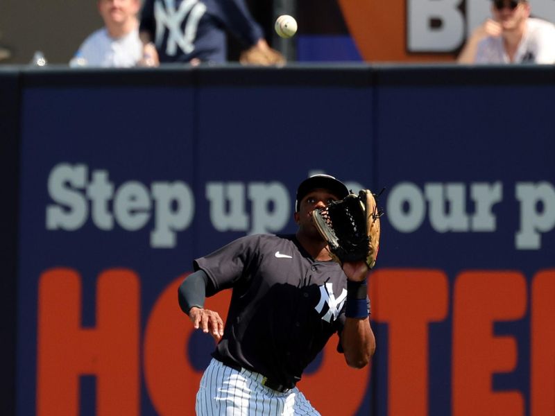 Mar 13, 2024; Tampa, Florida, USA;  New York Yankees outfielder Greg Allen (31) catches the ball for an out during the first inning against the Boston Red Sox at George M. Steinbrenner Field. Mandatory Credit: Kim Klement Neitzel-USA TODAY Sports