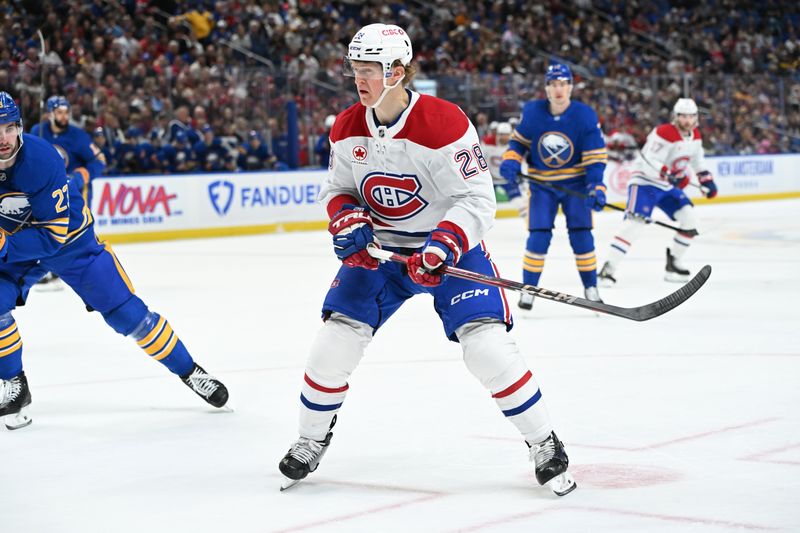 Nov 11, 2024; Buffalo, New York, USA; Montreal Canadiens center Christian Dvorak (28) on the ice against the Buffalo Sabres in the first period at KeyBank Center. Mandatory Credit: Mark Konezny-Imagn Images