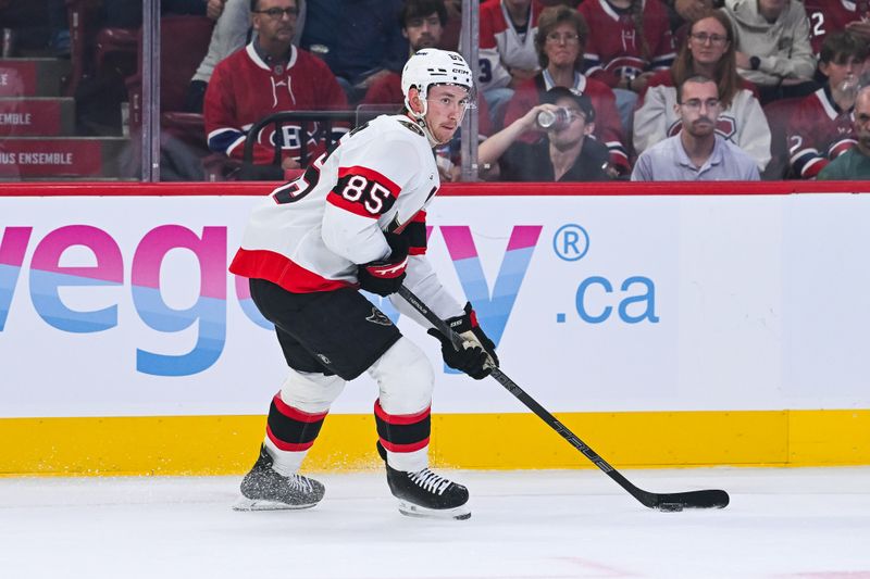 Oct 4, 2025; Montreal, Quebec, CAN; Ottawa Senators defenseman Jake Sanderson (85) plays the puck against the Montreal Canadiens during the first period at Bell Centre. Mandatory Credit: David Kirouac-Imagn Images