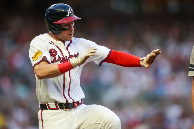 May 8, 2024; Atlanta, Georgia, USA; Atlanta Braves left fielder Jarred Kelenic (24) attempts to avoid a player against the Boston Red Sox in the second inning at Truist Park. Mandatory Credit: Brett Davis-USA TODAY Sports
