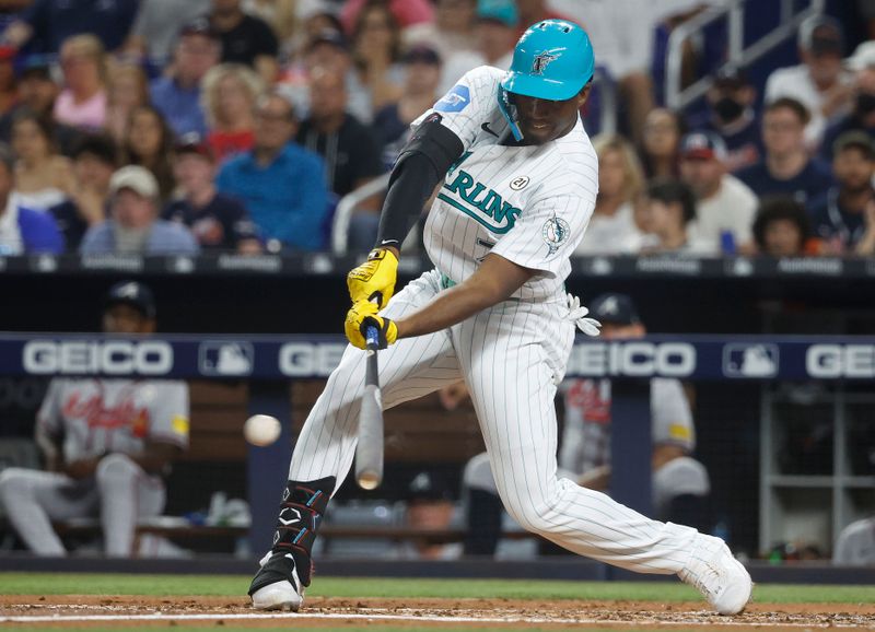 Sep 15, 2023; Miami, Florida, USA; Miami Marlins right fielder Jesus Sanchez (7) triples against the Atlanta Braves during the first inning at loanDepot Park. Mandatory Credit: Rhona Wise-USA TODAY Sports