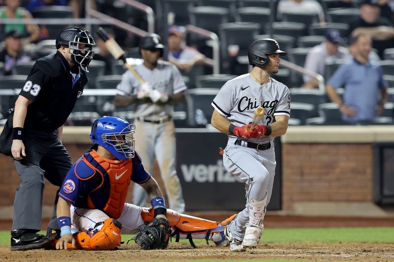 Jul 18, 2023; New York City, New York, USA; Chicago White Sox left fielder Andrew Benintendi (23) follows through on an RBI single against the New York Mets during the ninth inning at Citi Field. Mandatory Credit: Brad Penner-USA TODAY Sports