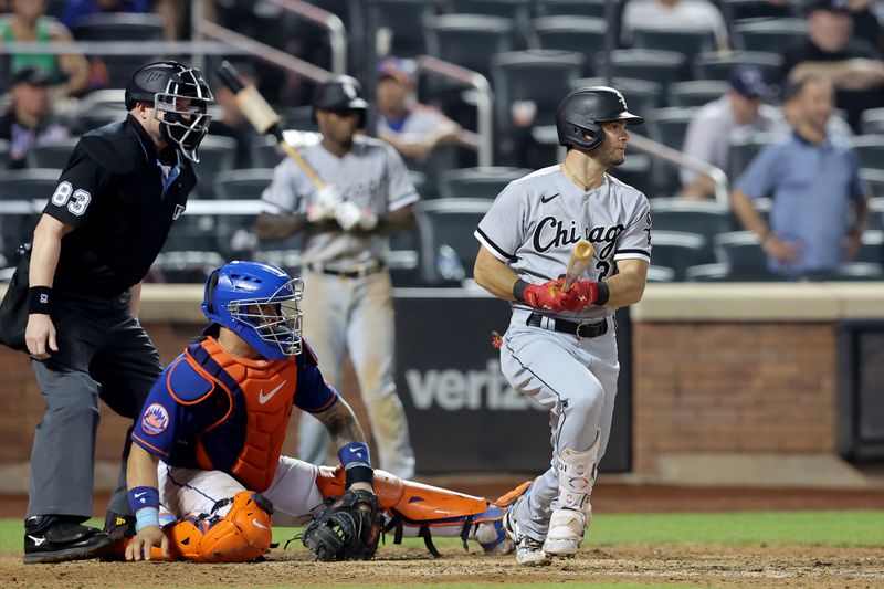 Jul 18, 2023; New York City, New York, USA; Chicago White Sox left fielder Andrew Benintendi (23) follows through on an RBI single against the New York Mets during the ninth inning at Citi Field. Mandatory Credit: Brad Penner-USA TODAY Sports