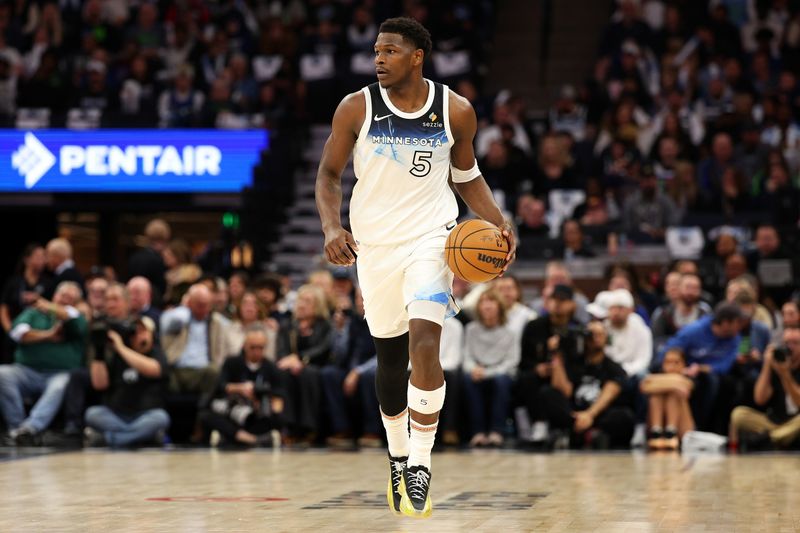 MINNEAPOLIS, MINNESOTA - NOVEMBER 17: Anthony Edwards #5 of the Minnesota Timberwolves dribbles the ball against the Phoenix Suns in the first quarter of the game at Target Center on November 17, 2024 in Minneapolis, Minnesota. NOTE TO USER: User expressly acknowledges and agrees that, by downloading and or using this photograph, User is consenting to the terms and conditions of the Getty Images License Agreement. (Photo by David Berding/Getty Images)