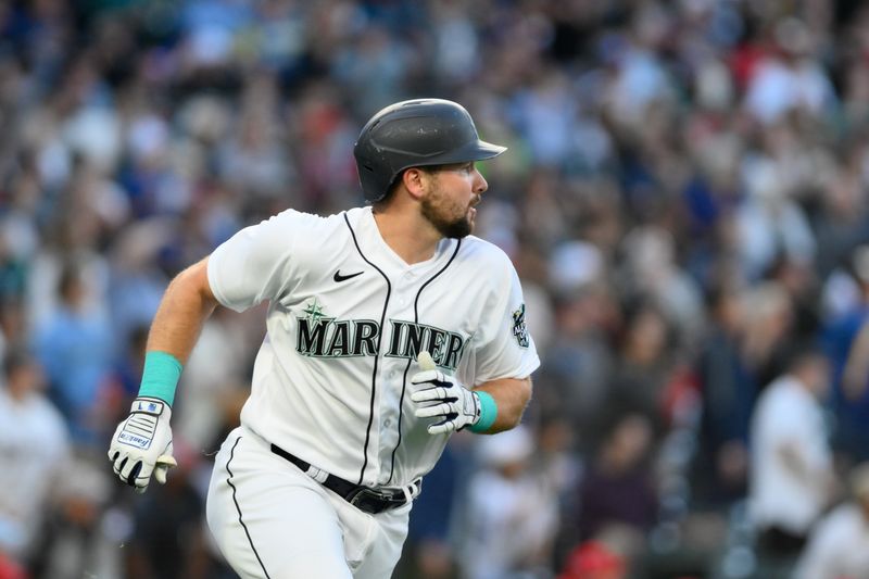 Sep 11, 2023; Seattle, Washington, USA; Seattle Mariners catcher Cal Raleigh (29) runs towards first base after hitting a two-run home run against the Los Angeles Angels during the first inning at T-Mobile Park. Mandatory Credit: Steven Bisig-USA TODAY Sports