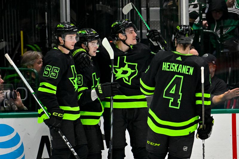 Jan 27, 2024; Dallas, Texas, USA; Dallas Stars defenseman Thomas Harley (55) and center Wyatt Johnston (53) and center Roope Hintz (24) and defenseman Miro Heiskanen (4) celebrates a goal scored by Johnston against the Washington Capitals during the first period at the American Airlines Center. Mandatory Credit: Jerome Miron-USA TODAY Sports