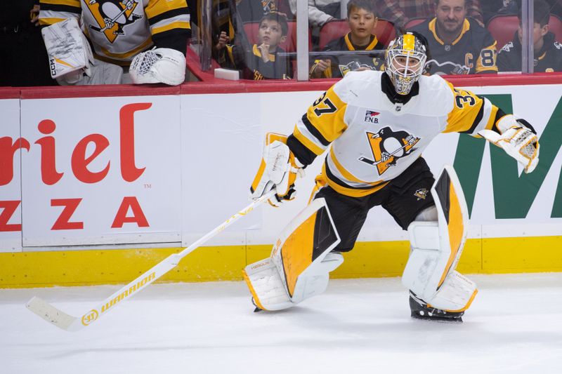 Dec 18, 2025; Ottawa, Ontario, CAN; Pittsburgh Penguins goalie Artus Silovs (37) follows the play as the Ottawa Senators skate up the ice after he was called to the bench with 6 minutes left in the third period at the Canadian Tire Centre. Mandatory Credit: Marc DesRosiers-IMAGN Images