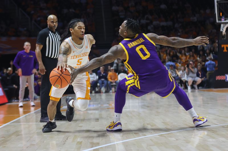 Feb 7, 2024; Knoxville, Tennessee, USA; LSU Tigers guard Trae Hannibal (0) knocks the ball out of bounds against Tennessee Volunteers guard Zakai Zeigler (5) during the second half at Thompson-Boling Arena at Food City Center. Mandatory Credit: Randy Sartin-USA TODAY Sports