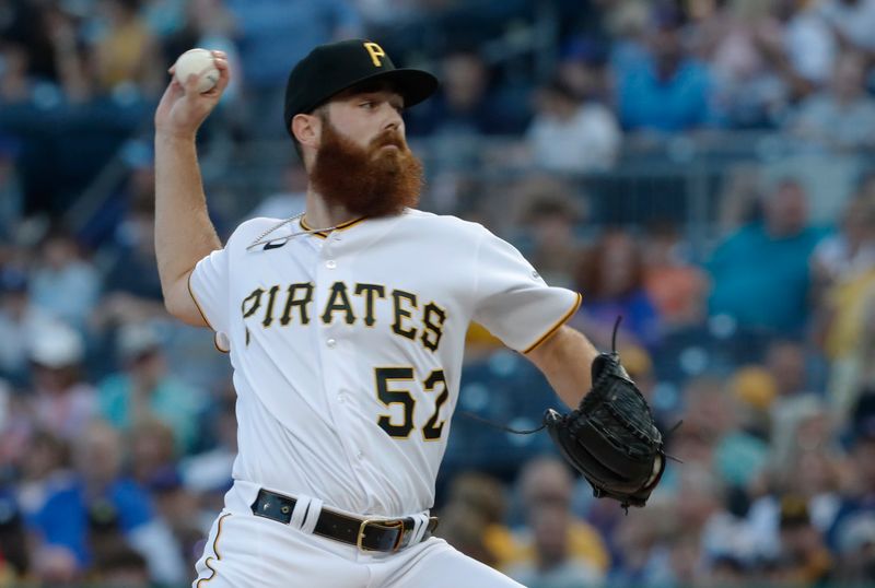 Aug 26, 2023; Pittsburgh, Pennsylvania, USA;  Pittsburgh Pirates starting pitcher Colin Selby (52) delivers a pitch against the Chicago Cubs at PNC Park. Mandatory Credit: Charles LeClaire-USA TODAY Sports