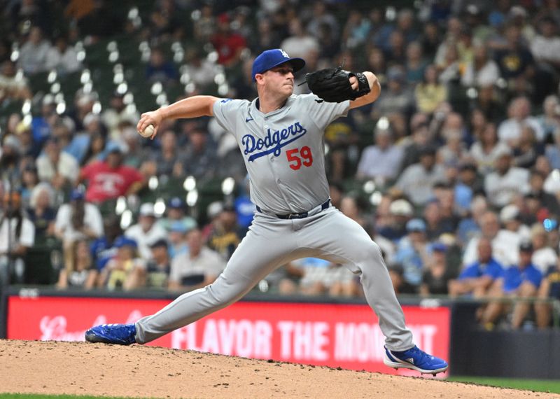 Aug 14, 2024; Milwaukee, Wisconsin, USA; Los Angeles Dodgers pitcher Evan Phillips (59) delivers a pitch against the Milwaukee Brewers in the seventh inning at American Family Field. Mandatory Credit: Michael McLoone-USA TODAY Sports