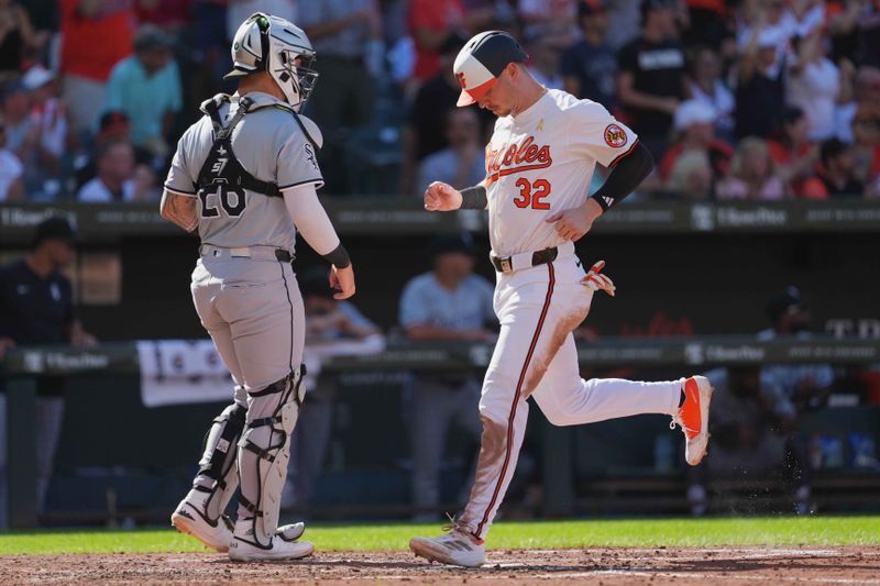 Sep 2, 2024; Baltimore, Maryland, USA; Baltimore Orioles first baseman Ryan O’Hearn (32) scores on a hit by outfielder Austin Slater (not shown) during the third inning against the Chicago White Sox at Oriole Park at Camden Yards. Mandatory Credit: Mitch Stringer-USA TODAY Sports