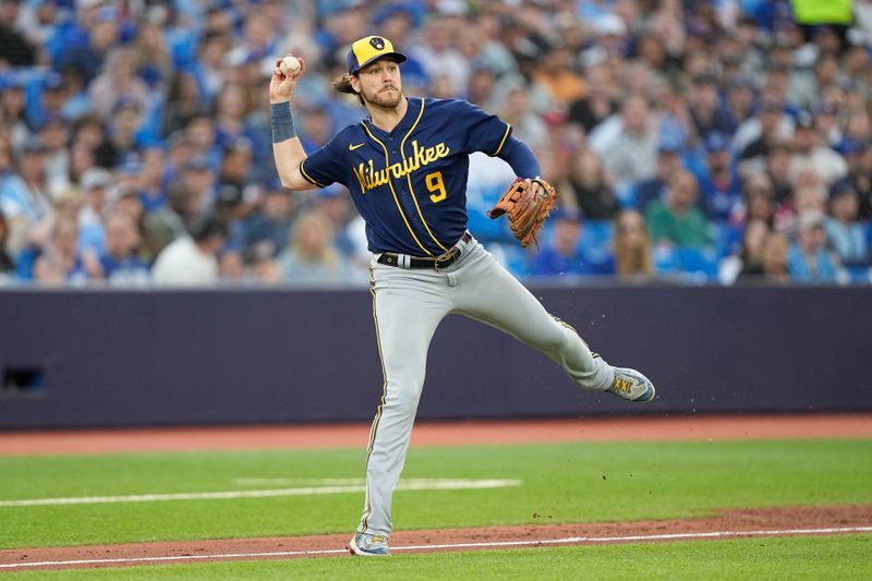 May 30, 2023; Toronto, Ontario, CAN; Milwaukee Brewers third baseman Brian Anderson (9) throws to first base during the third inning against the Toronto Blue Jays at Rogers Centre. Mandatory Credit: John E. Sokolowski-USA TODAY Sports