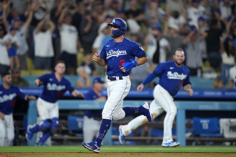 Jul 25, 2023; Los Angeles, California, USA; Los Angeles Dodgers shortstop Chris Taylor (3) scores the winning run in the 10th inning against the Toronto Blue Jays at Dodger Stadium. Mandatory Credit: Kirby Lee-USA TODAY Sports