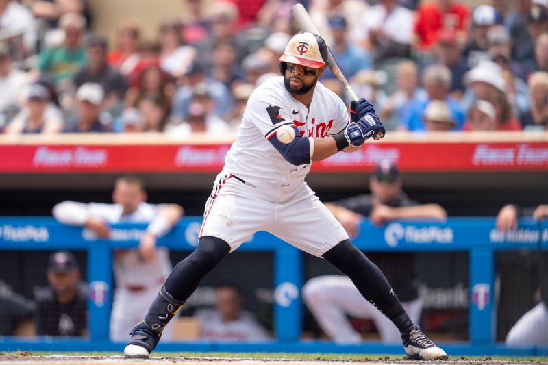 Jul 21, 2024; Minneapolis, Minnesota, USA; Minnesota Twins first base Carlos Santana (30) watches a ball go by in the second inning against the Milwaukee Brewers at Target Field. Mandatory Credit: Matt Blewett-USA TODAY Sports