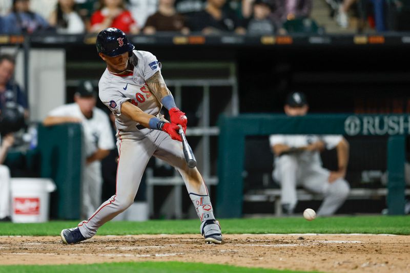 Jun 6, 2024; Chicago, Illinois, USA; Boston Red Sox outfielder Ceddanne Rafaela (43) hits an RBI-single against the Chicago White Sox during the sixth inning at Guaranteed Rate Field. Mandatory Credit: Kamil Krzaczynski-USA TODAY Sports