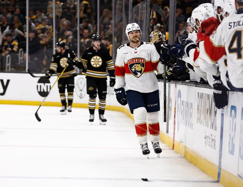 May 10, 2024; Boston, Massachusetts, USA; With a rat on the ice, Florida Panthers center Sam Reinhart (13) is congratulated at the bench after scoring against the Boston Bruins during the third period of game three of the second round of the 2024 Stanley Cup Playoffs at TD Garden. Mandatory Credit: Winslow Townson-USA TODAY Sports