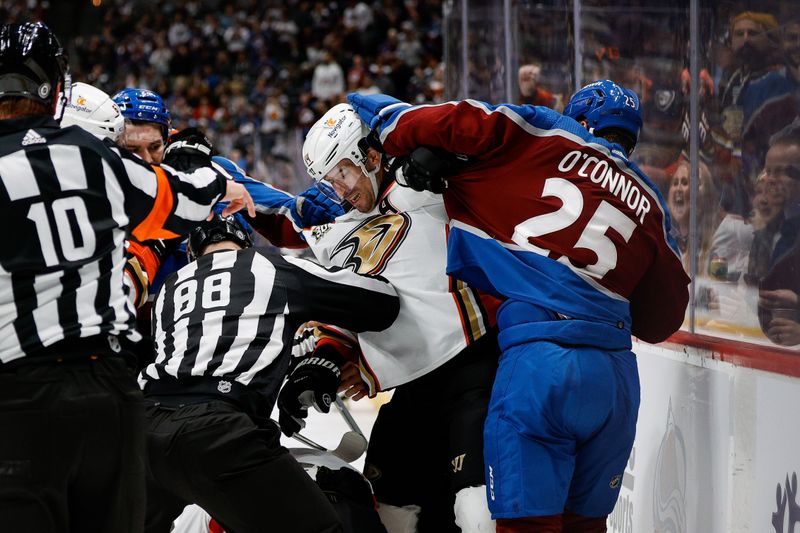 Dec 5, 2023; Denver, Colorado, USA; Colorado Avalanche right wing Logan O'Connor (25) and Anaheim Ducks center Adam Henrique (14) get tangled up after a play in the second period at Ball Arena. Mandatory Credit: Isaiah J. Downing-USA TODAY Sports