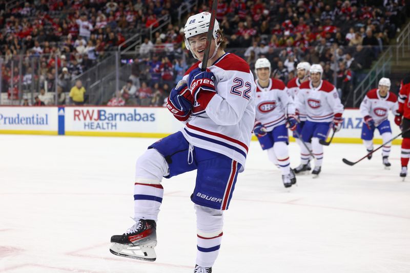 Jan 17, 2024; Newark, New Jersey, USA; Montreal Canadiens right wing Cole Caufield (22) celebrates his goal against the New Jersey Devils during the third period at Prudential Center. Mandatory Credit: Ed Mulholland-USA TODAY Sports