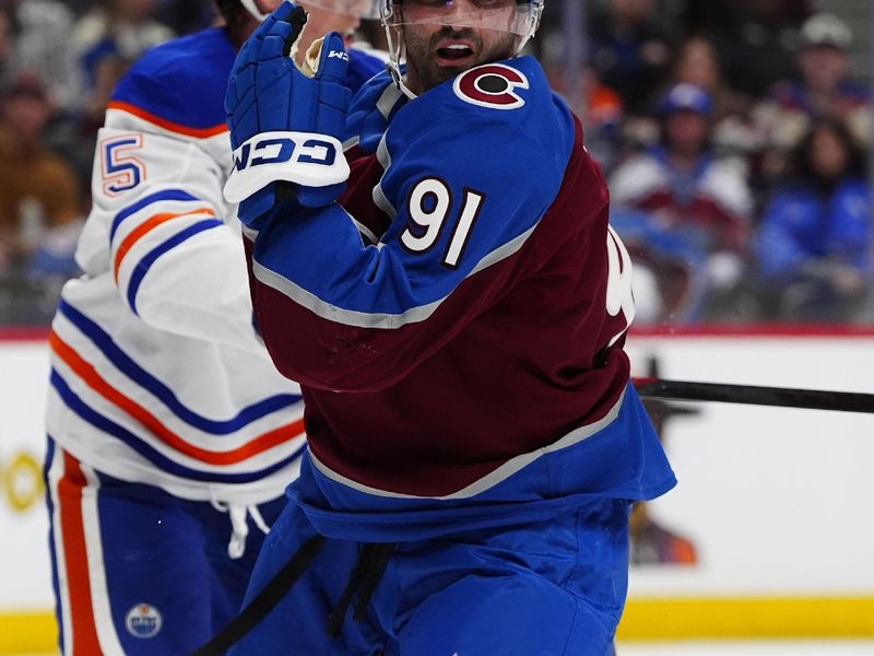 Mar 10, 2026; Denver, Colorado, USA; Colorado Avalanche center Nazem Kadri (91) during the second period against the Edmonton Oilers at Ball Arena. Mandatory Credit: Ron Chenoy-Imagn Images