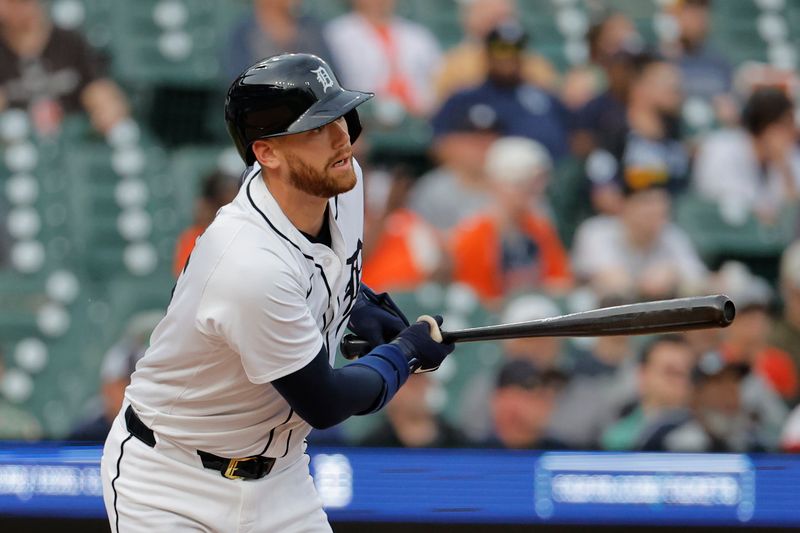 May 13, 2024; Detroit, Michigan, USA;  Detroit Tigers catcher Carson Kelly (15) hits an RBI single in the second inning against the Miami Marlins at Comerica Park. Mandatory Credit: Rick Osentoski-USA TODAY Sports