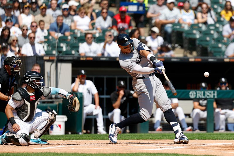 Aug 31, 2025; Chicago, Illinois, USA; New York Yankees designated hitter Aaron Judge (99) hits a solo home run against the Chicago White Sox during the first inning at Rate Field. Mandatory Credit: Kamil Krzaczynski-Imagn Images