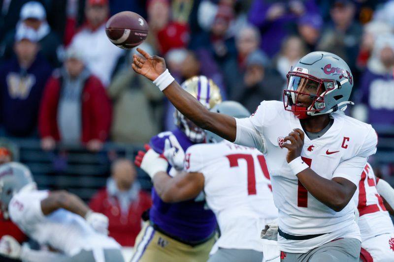 Nov 25, 2023; Seattle, Washington, USA; Washington State Cougars quarterback Cameron Ward (1) passes against the Washington Huskies during the first quarter at Alaska Airlines Field at Husky Stadium. Mandatory Credit: Joe Nicholson-USA TODAY Sports