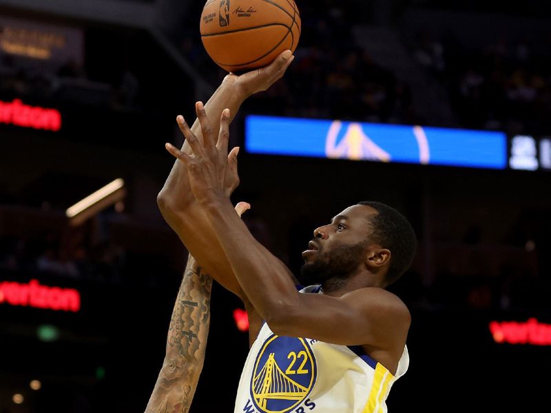 SAN FRANCISCO, CALIFORNIA - OCTOBER 18: Andrew Wiggins #22 of the Golden State Warriors shoots over Jalen Hood-Schifino #0 of the Los Angeles Lakers during the first half of their preseason game at Chase Center on October 18, 2024 in San Francisco, California.  NOTE TO USER: User expressly acknowledges and agrees that, by downloading and/or using this photograph, user is consenting to the terms and conditions of the Getty Images License Agreement.  (Photo by Ezra Shaw/Getty Images)