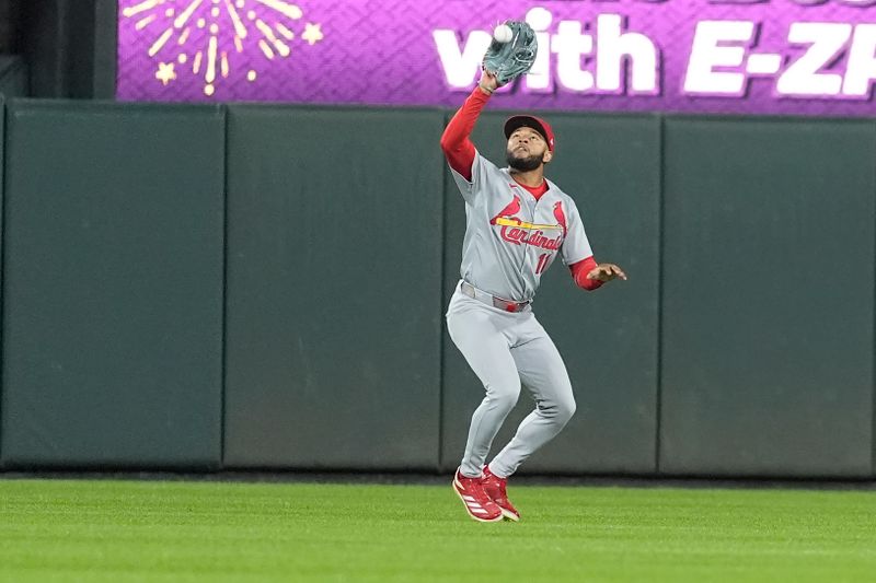 May 28, 2025; Baltimore, Maryland, USA; St. Louis Cardinals center fielder Victor Scott II (11) catches a fly ball hit by Baltimore Orioles shortstop Gunnar Henderson (2) (not pictured) during the ninth inning at Oriole Park at Camden Yards. Mandatory Credit: Gregory Fisher-Imagn Images