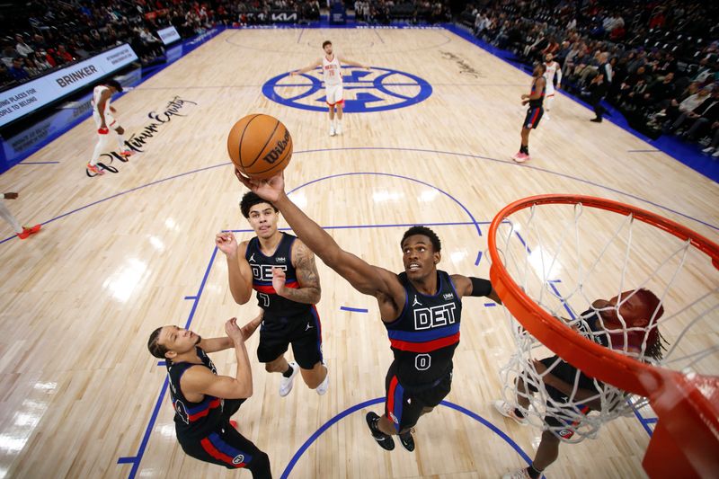 DETROIT, MI - JANUARY 12: Jalen Duren #0 of the Detroit Pistons rebounds the ball during the game against the Houston Rockets on January 12, 2024 at Little Caesars Arena in Detroit, Michigan. NOTE TO USER: User expressly acknowledges and agrees that, by downloading and/or using this photograph, User is consenting to the terms and conditions of the Getty Images License Agreement. Mandatory Copyright Notice: Copyright 2024 NBAE (Photo by Brian Sevald/NBAE via Getty Images)