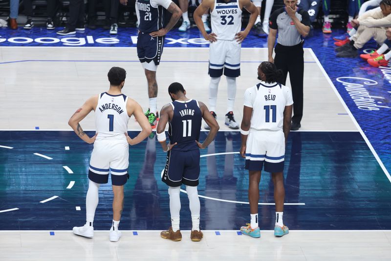 DALLAS, TX - MAY 26: Kyle Anderson #1 and Naz Reid #11 of the Minnesota Timberwolves, and Kyrie Irving #11 of the Dallas Mavericks look on during the game during Game 3 of the Western Conference Finals of the 2024 NBA Playoffs on May 26, 2024 at the American Airlines Center in Dallas, Texas. NOTE TO USER: User expressly acknowledges and agrees that, by downloading and or using this photograph, User is consenting to the terms and conditions of the Getty Images License Agreement. Mandatory Copyright Notice: Copyright 2024 NBAE (Photo by David Sherman/NBAE via Getty Images)