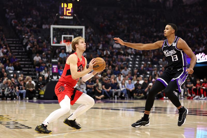 SACRAMENTO, CALIFORNIA - NOVEMBER 06: Gradey Dick #1 of the Toronto Raptors gets ready to shoot over Keegan Murray #13 of the Sacramento Kings in the first half at Golden 1 Center on November 06, 2024 in Sacramento, California. NOTE TO USER: User expressly acknowledges and agrees that, by downloading and/or using this photograph, user is consenting to the terms and conditions of the Getty Images License Agreement.  (Photo by Ezra Shaw/Getty Images)