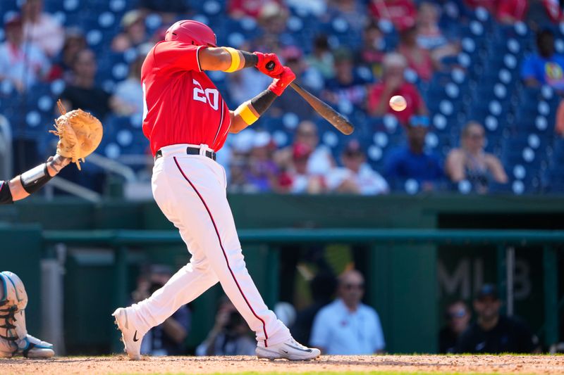 Sep 3, 2023; Washington, District of Columbia, USA;  Washington Nationals designated hitter Keibert Ruiz (20) hits a single against the Miami Marlins during the eighth inning at Nationals Park. Mandatory Credit: Gregory Fisher-USA TODAY Sports