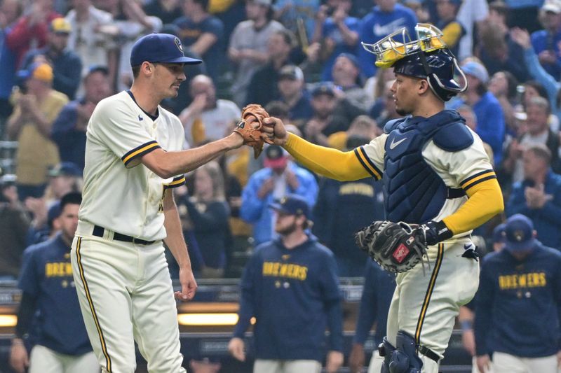 May 24, 2023; Milwaukee, Wisconsin, USA; Milwaukee Brewers pitcher Hoby Milner (55) and catcher William Contreras (24) celebrates after beating the Houston Astros at American Family Field. Mandatory Credit: Benny Sieu-USA TODAY Sports