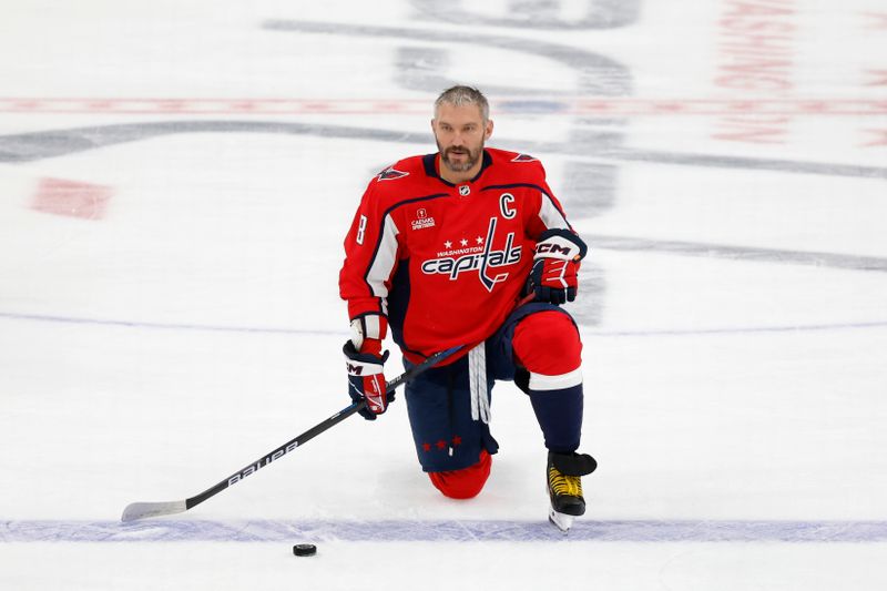 Sep 28, 2023; Washington, District of Columbia, USA; Washington Capitals left wing Alex Ovechkin (8) kneels on the ice during warmup prior to the game against the Detroit Red Wings at Capital One Arena. Mandatory Credit: Geoff Burke-USA TODAY Sports