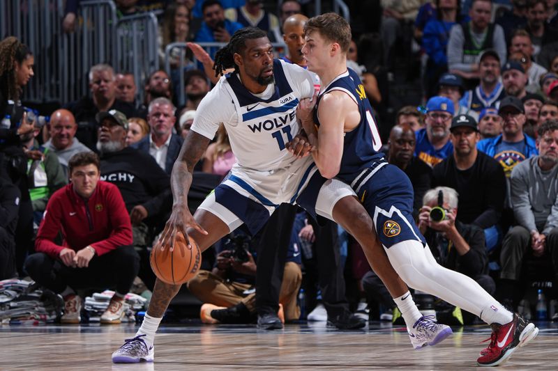 DENVER, CO - APRIL 10:  Naz Reid #11 of the Minnesota Timberwolves dribbles the ball during the game against the Denver Nuggets on April 10, 2024 at the Ball Arena in Denver, Colorado. NOTE TO USER: User expressly acknowledges and agrees that, by downloading and/or using this Photograph, user is consenting to the terms and conditions of the Getty Images License Agreement. Mandatory Copyright Notice: Copyright 2024 NBAE (Photo by Garrett Ellwood/NBAE via Getty Images)