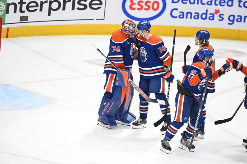 May 12, 2025; Edmonton, Alberta, CAN; Edmonton Oilers goalie Stuart Skinner (74) celebrates their win with defenseman John Klingberg (36) over the Las Vegas Golden Knights during the third period in game three of the second round of the 2025 Stanley Cup Playoffs at Rogers Place. Mandatory Credit: Walter Tychnowicz-Imagn Images