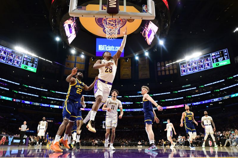 LOS ANGELES, CA - MACH 16: Rui Hachimura #28 of the Los Angeles Lakers drives to the basket during the game against the Golden State Warriors on March 16, 2024 at Crypto.Com Arena in Los Angeles, California. NOTE TO USER: User expressly acknowledges and agrees that, by downloading and/or using this Photograph, user is consenting to the terms and conditions of the Getty Images License Agreement. Mandatory Copyright Notice: Copyright 2024 NBAE (Photo by Adam Pantozzi/NBAE via Getty Images)