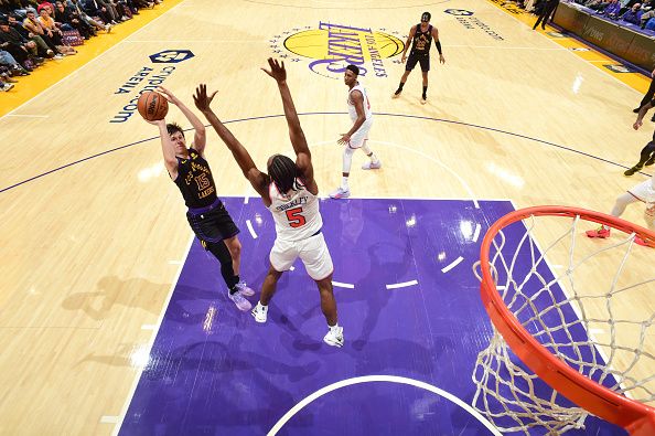 LOS ANGELES, CA - DECEMBER 18:  Austin Reaves #15 of the Los Angeles Lakers shoots the ball during the game  on December 18, 2023 at Crypto.Com Arena in Los Angeles, California. NOTE TO USER: User expressly acknowledges and agrees that, by downloading and/or using this Photograph, user is consenting to the terms and conditions of the Getty Images License Agreement. Mandatory Copyright Notice: Copyright 2023 NBAE (Photo by Adam Pantozzi/NBAE via Getty Images)