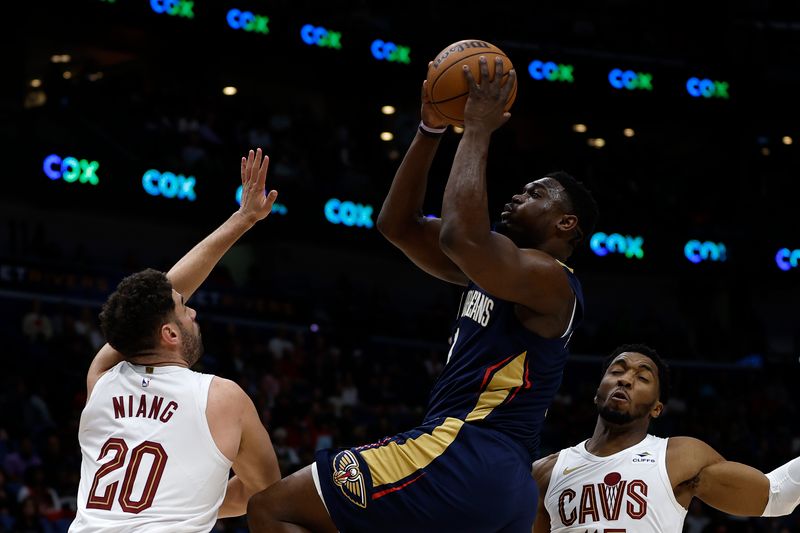 NEW ORLEANS, LOUISIANA - MARCH 13: Zion Williamson #1 of the New Orleans Pelicans shoots the ball over Georges Niang #20 of the Cleveland Cavaliers at Smoothie King Center on March 13, 2024 in New Orleans, Louisiana.   NOTE TO USER: User expressly acknowledges and agrees that, by downloading and or using this photograph, User is consenting to the terms and conditions of the Getty Images License Agreement.  (Photo by Chris Graythen/Getty Images)