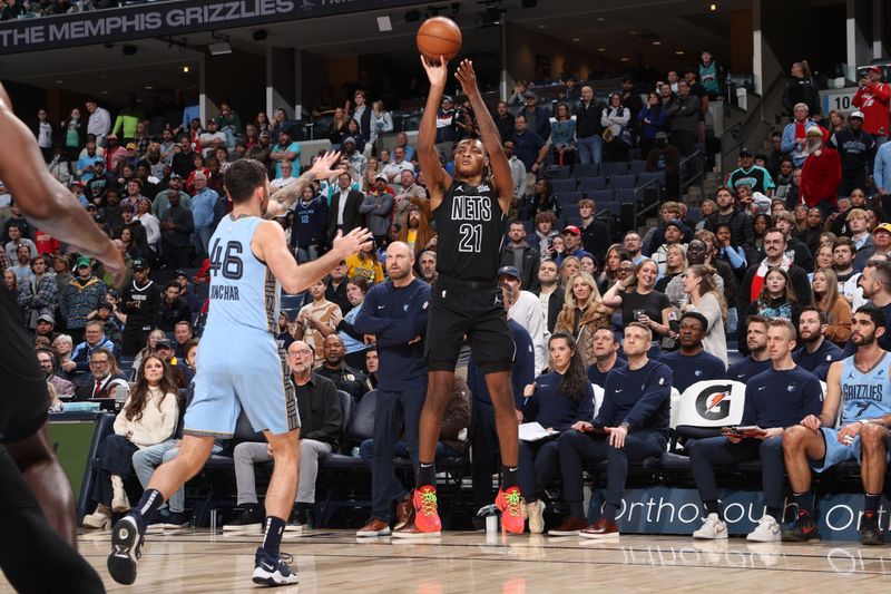 MEMPHIS, TN - DECEMBER 13: Noah Clowney #21 of the Brooklyn Nets  shoots a three point basket during the game against the Memphis Grizzlies on December 13, 2024 at FedExForum in Memphis, Tennessee. NOTE TO USER: User expressly acknowledges and agrees that, by downloading and or using this photograph, User is consenting to the terms and conditions of the Getty Images License Agreement. Mandatory Copyright Notice: Copyright 2024 NBAE (Photo by Joe Murphy/NBAE via Getty Images)