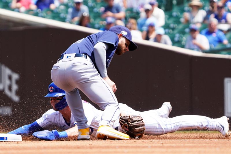 May 31, 2023; Chicago, Illinois, USA; Chicago Cubs designated hitter Nico Hoerner (2) steals second base as Tampa Bay Rays second baseman Brandon Lowe (8) makes a late tag during the first inning at Wrigley Field. Mandatory Credit: David Banks-USA TODAY Sports