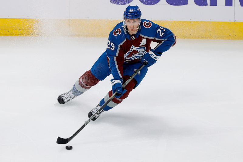 Oct 19, 2023; Denver, Colorado, USA; Colorado Avalanche center Nathan MacKinnon (29) controls the puck in the third period against the Chicago Blackhawks at Ball Arena. Mandatory Credit: Isaiah J. Downing-USA TODAY Sports