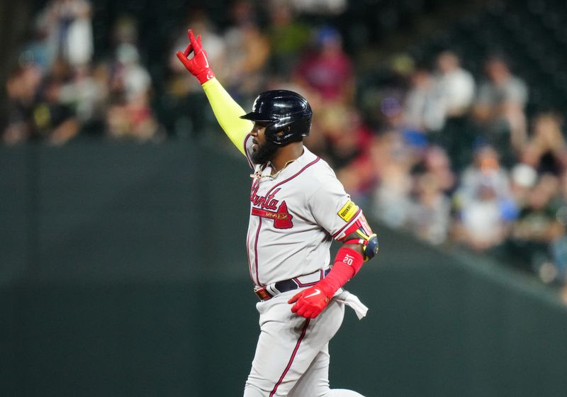 Aug 30, 2023; Denver, Colorado, USA; Atlanta Braves designated hitter Marcell Ozuna (20) celebrates his solo home run in the sixth inning against the Colorado Rockies at Coors Field. Mandatory Credit: Ron Chenoy-USA TODAY Sports