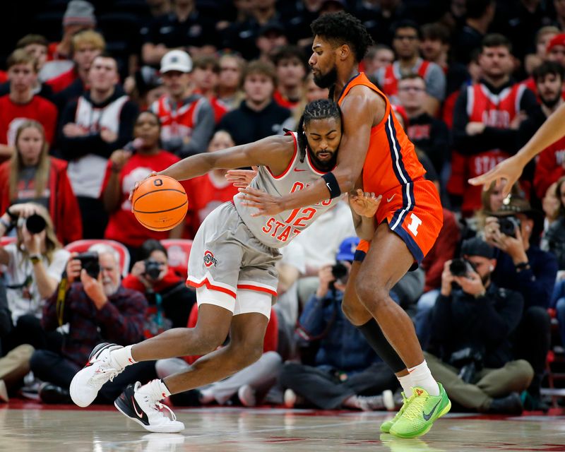 Jan 30, 2024; Columbus, Ohio, USA; Ohio State Buckeyes guard Evan Mahaffey (12) is stopped by Illinois Fighting Illini forward Quincy Guerrier (13) during the second half at Value City Arena. Mandatory Credit: Joseph Maiorana-USA TODAY Sports