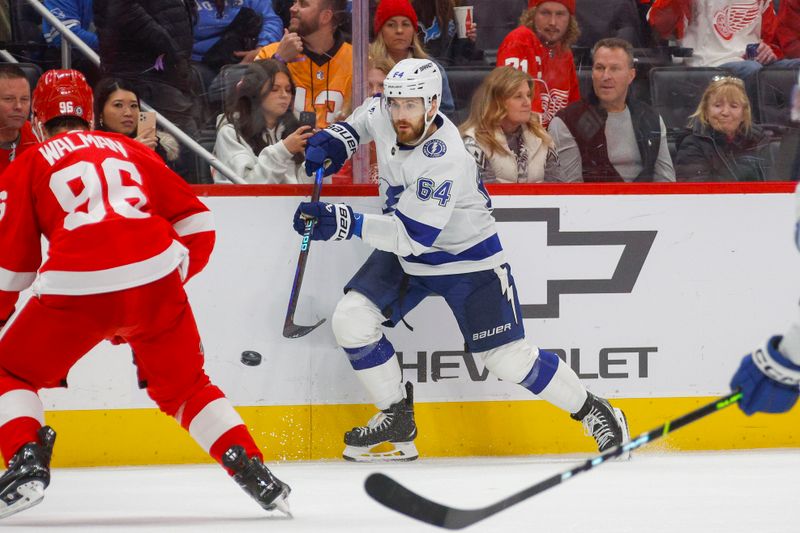 Jan 21, 2024; Detroit, Michigan, USA; Tampa Bay Lightning center Tyler Motte (64) passes the puck during the third period against the Detroit Red Wings at Little Caesars Arena. Mandatory Credit: Brian Bradshaw Sevald-USA TODAY Sports