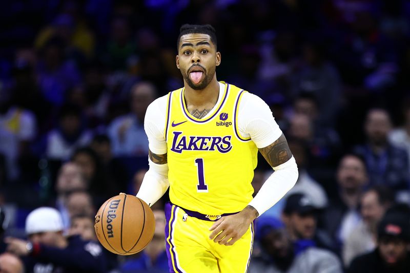 PHILADELPHIA, PENNSYLVANIA - NOVEMBER 27: D'Angelo Russell #1 of the Los Angeles Lakers dribbles during the third quarter against the Philadelphia 76ers at the Wells Fargo Center on November 27, 2023 in Philadelphia, Pennsylvania. NOTE TO USER: User expressly acknowledges and agrees that, by downloading and or using this photograph, User is consenting to the terms and conditions of the Getty Images License Agreement. (Photo by Tim Nwachukwu/Getty Images)