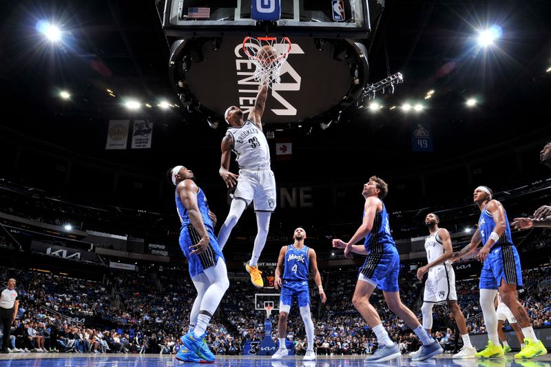 ORLANDO, FL - MARCH 13: Nicolas Claxton #33 of the Brooklyn Nets dunks the ball during the game against the Orlando Magic on March 13, 2024 at the Kia Center in Orlando, Florida. NOTE TO USER: User expressly acknowledges and agrees that, by downloading and or using this photograph, User is consenting to the terms and conditions of the Getty Images License Agreement. Mandatory Copyright Notice: Copyright 2024 NBAE (Photo by Fernando Medina/NBAE via Getty Images)